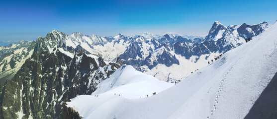 group of mountaineers climbing up on snow slopes, Mont Blanc massive, French Alps  - 594294191