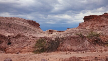 Scenic landscape featuring a rocky terrain in a juxtaposition of desert and water