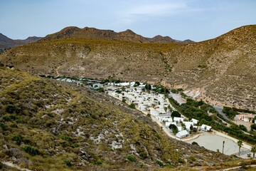 Scenic hilly valley with small town, rural landscape