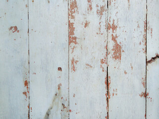 Wooden planks with paint starting to peel off. 