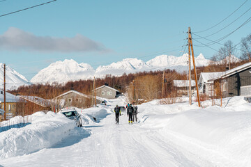 Ski alpinist across the street in Lyngen Alps, Norway