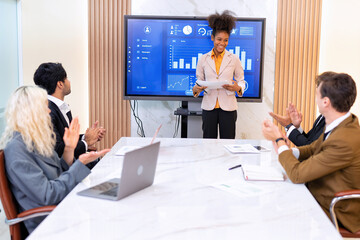 Employee on job corporate Business colleagues around the table look presentation from large screen