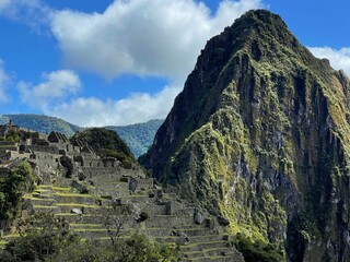 Landscape of the stunning mountains of Machu Picchu covered in the fog in Peru