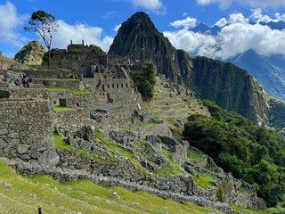 Landscape of the stunning mountains of Machu Picchu covered in the fog in Peru