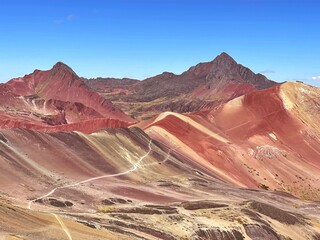 Landscape of the rainbow mountain under a blue sky in Peru