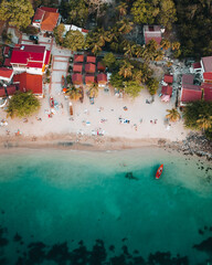 Aerial Drone view of Anse Doufur caribbean island of Martiniqze. Turquoise blue water with boats...