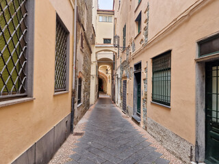 narrow streets of noli medieval village liguria italy - obrazy, fototapety, plakaty