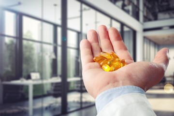 Dietary supplement concept, hand hold pills