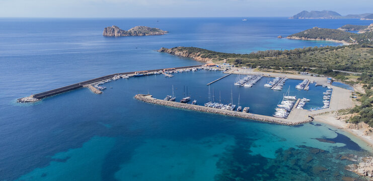 Port of teulada and aerial view of porto tramatzu beach in south sardinia
