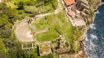 Muurstickers Aerial view of the Odeon and the Roman theater of the imperial villa in the archaeological park of Pausilypon. The ancient Roman ruins are located in the Posillipo district, in Naples, Campania, Italy © Stefano Tammaro