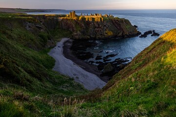 Beautiful sunset over the Dunnottar Castle on the northeast coast of Scotland near Stonehaven.