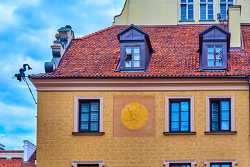A sundial on the facade of a house in the Old Town in Warsaw