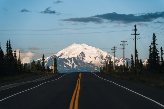 Driving towards Glenallen on Highway 1, the Glenn Highway, in Alaska, leads right in front of Mount Drum, with its snowy peak towering at the end of the road
