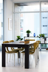 Brilliant ideas are discovered in here. coffee and paperwork on a desk in an empty office during the day.