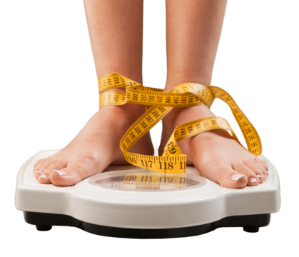 Young woman feet standing on weigh scales,