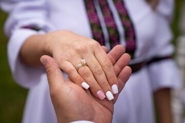 Closeup of wedding hands of a bride and a groom