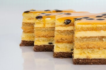 Slices of yellowish cakes on studio background