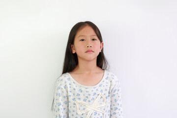 Asian little girl posing isolated having indifferent facial expression, tired, looking depressed.