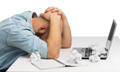 Businessman with stress working on office desk