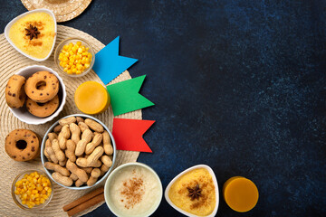 Festa Junina Summer Festival Carnival concept. Brazilian straw hat, popcorn, peanuts and Corn Cakes on Wooden Background for Brazilian Festa Junina Summer Festival