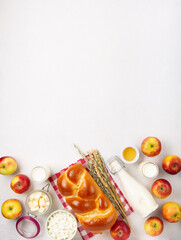 Jewish Shavuot Holiday Card. Dairy Products, Apples, Cheese, Bread, Milk on White Background.
