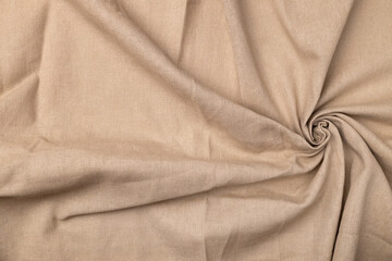 Natural linen fabric texture. Flaxen circular spiral textile background, top view. Rough twisted burlap