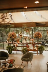 Interior of a restaurant decorated with flowers for a wedding celebration ceremony