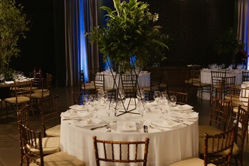 Interior of a restaurant decorated with flowers for a wedding celebration ceremony