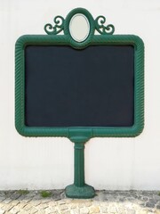 Mockup blank billboard for a notice, advertisement, announcement or message. Retro forged iron frame