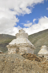 Fototapeta na wymiar A old Stupa next to dry mountain on the way to Darcha-Padum Road 