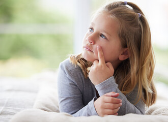 What should I have for lunch. a young girl relaxing in her bedroom daydreaming.