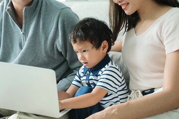 parent and child using laptop