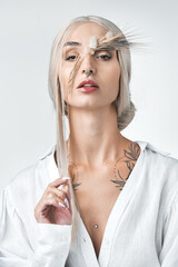 Theres beauty in simplicity. Studio shot of an attractive young woman posing against a white...