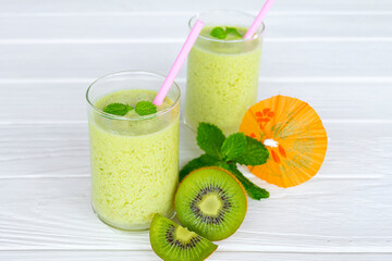 Kiwi yogurt fruit juice smoothie and green kiwi juice drink healthy, delicious taste in a glass for...