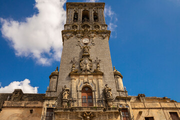 Fototapeta na wymiar Bell Tower of the Basilica de Santa Maria in the Plaza del Cabildo, Arcos de la Frontera, Andalucia, Spain.