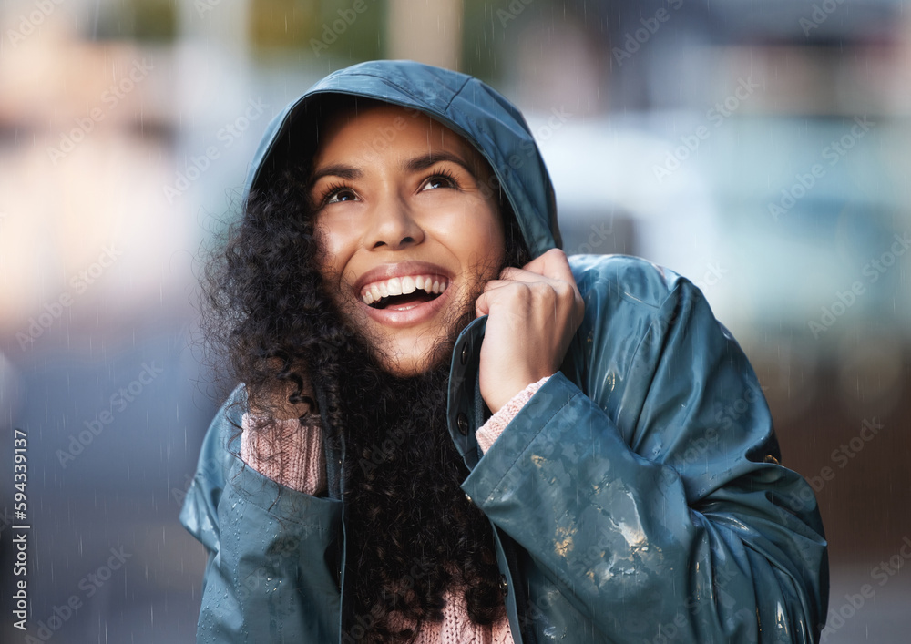 Sticker This weather sure is something. a young woman admiring the rain in the city.