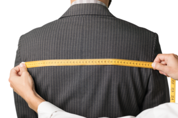 Tailor measuring the size for a tailor made suite for a man model