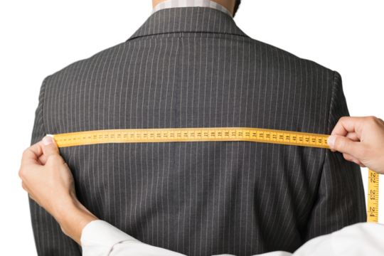 Tailor measuring the size for a tailor made suite for a man model