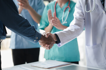 Conference room in the hospital, a group of doctors attending a handshake meeting, a meeting of...