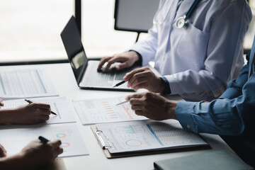 A conference room in a hospital where a group of doctors are attending a meeting, a meeting of executive doctors and chiefs meeting with pharmaceutical dealers. Doctor meeting concept.