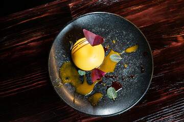 exquisite sphere-shaped yellow dessert