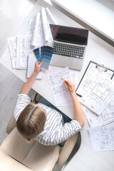 Naklejka premium Architects concept, engineer architect designer freelance work on start-up project drawing, construction plan. architect design working drawing sketch plans blueprints and making construction model
