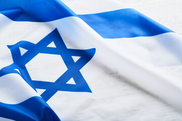 Independence Day of Israel. National Israel flag with star of David over white wooden background....