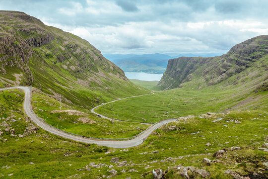Driving the Bealach na Ba single track scenic road from Applecross. View from the pass in North West Highlands, Scotland, UK