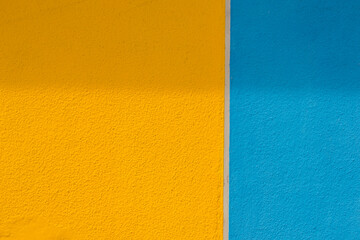 concrete  background of blue and yellow colors