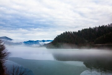 High-angle view of a landscape in the fog during the autumn.