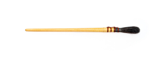 Watercolor paint brushes on white background. Pointed brushes. Close up.