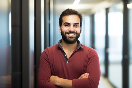 Portrait Of A Confident Middle Eastern Man In Office Hallway, Professional Environment And Corporate Casual Attire, Generative Ai