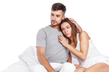 Man consoles his wife lying bed in bedroom, couple consoling, husband embrace comforts his woman