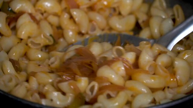 Stock footage for cooking pasta. home cooked pasta in Indian style.